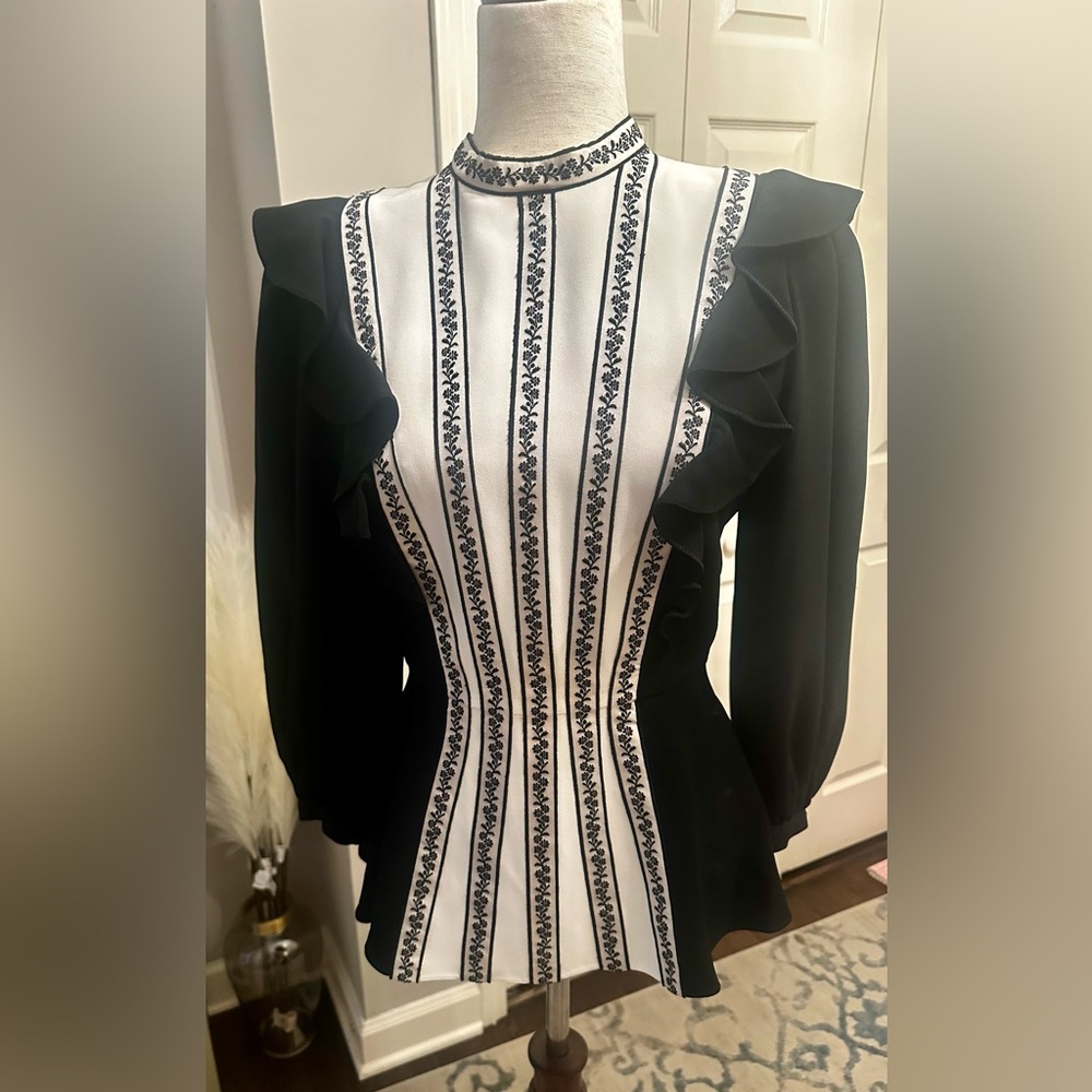 Stunning blouse.  Figure flattering.